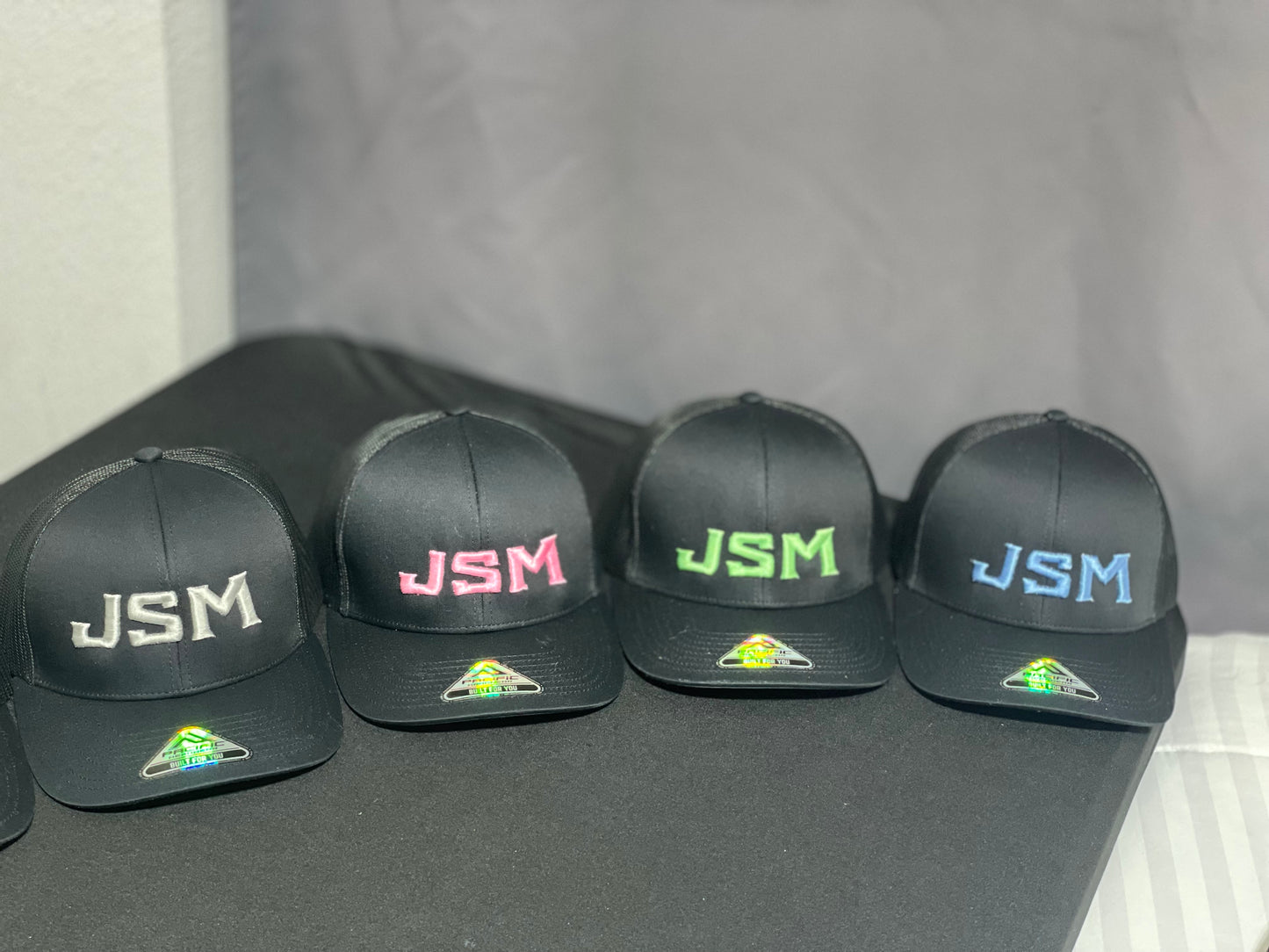 JSM Black Embroidered Snapback Mesh Cap